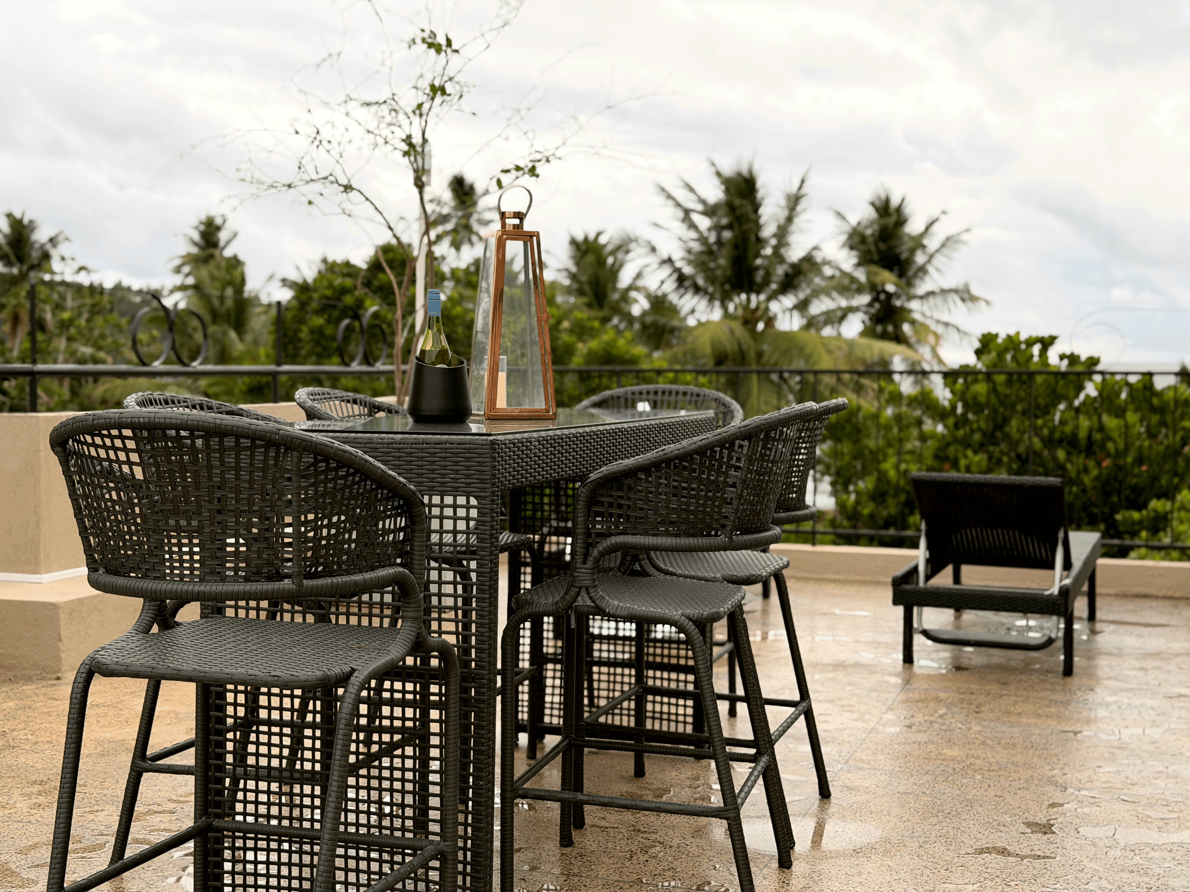 Terrace seating at Ayu by TARA with turquoise cushions